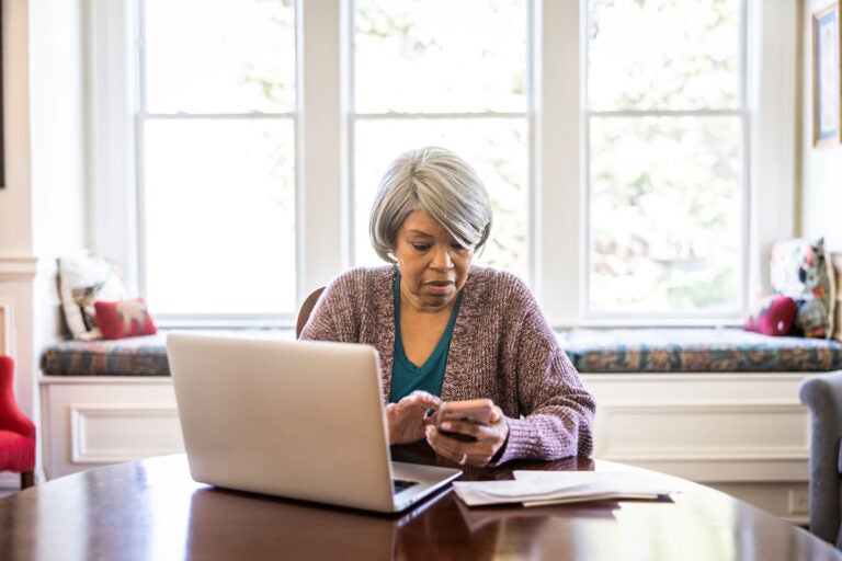 A woman calculating whether she can afford to age in place