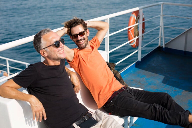 two gen x men take it easy on a boat and talk genx retirement planning strategies