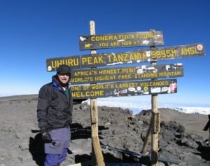 Ralph Perry on top of Mt. Kilamanjaro