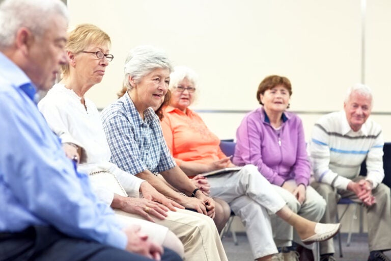Some seniors enjoy a meeting arranged by an area agency on aging