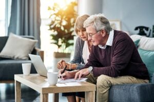 couple revieweing their retirement account withdrawal strategies