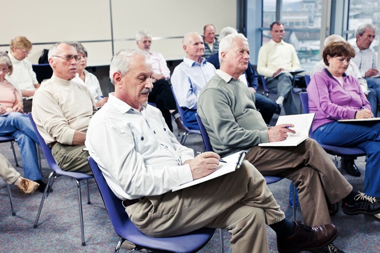 A group of people learning about who regulates reverse mortgages