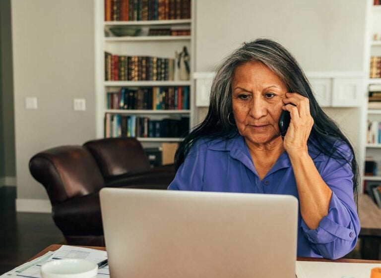 A woman researching her reverse mortgage and social security