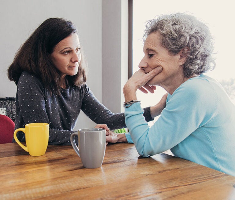 A mother and daughter discussing social security survivor benefits