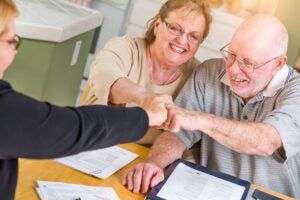 A couple meeting with a retirement planner to supercharge their retirement