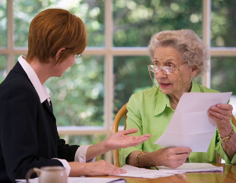 a woman discussing credit and reverse mortgages