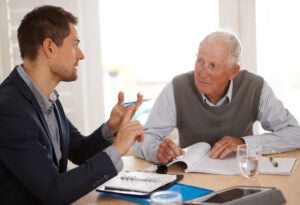 A man learning what an annuity is from a financial advisor